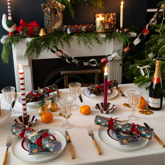 Luxury Christmas crackers laid out on a festive table